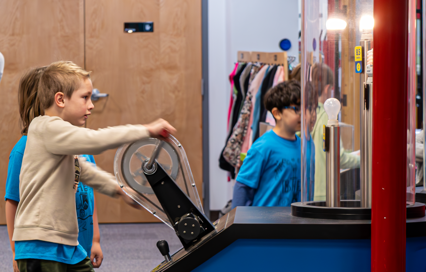 children exploring science exhibits